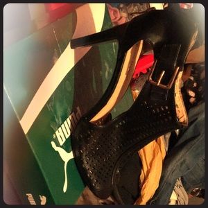 Black heal with gold buckle